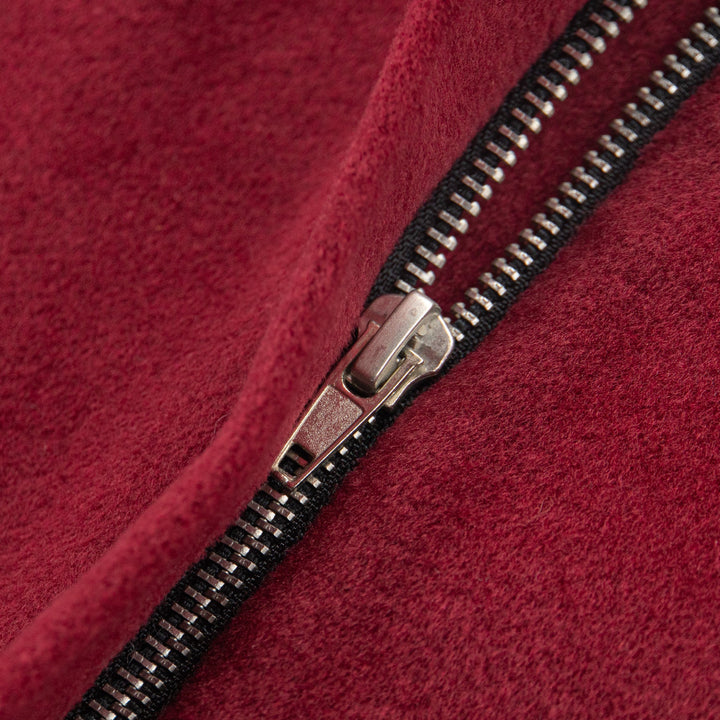 A scarlet woollen coat, two front pockets and a zipper for front fastening.