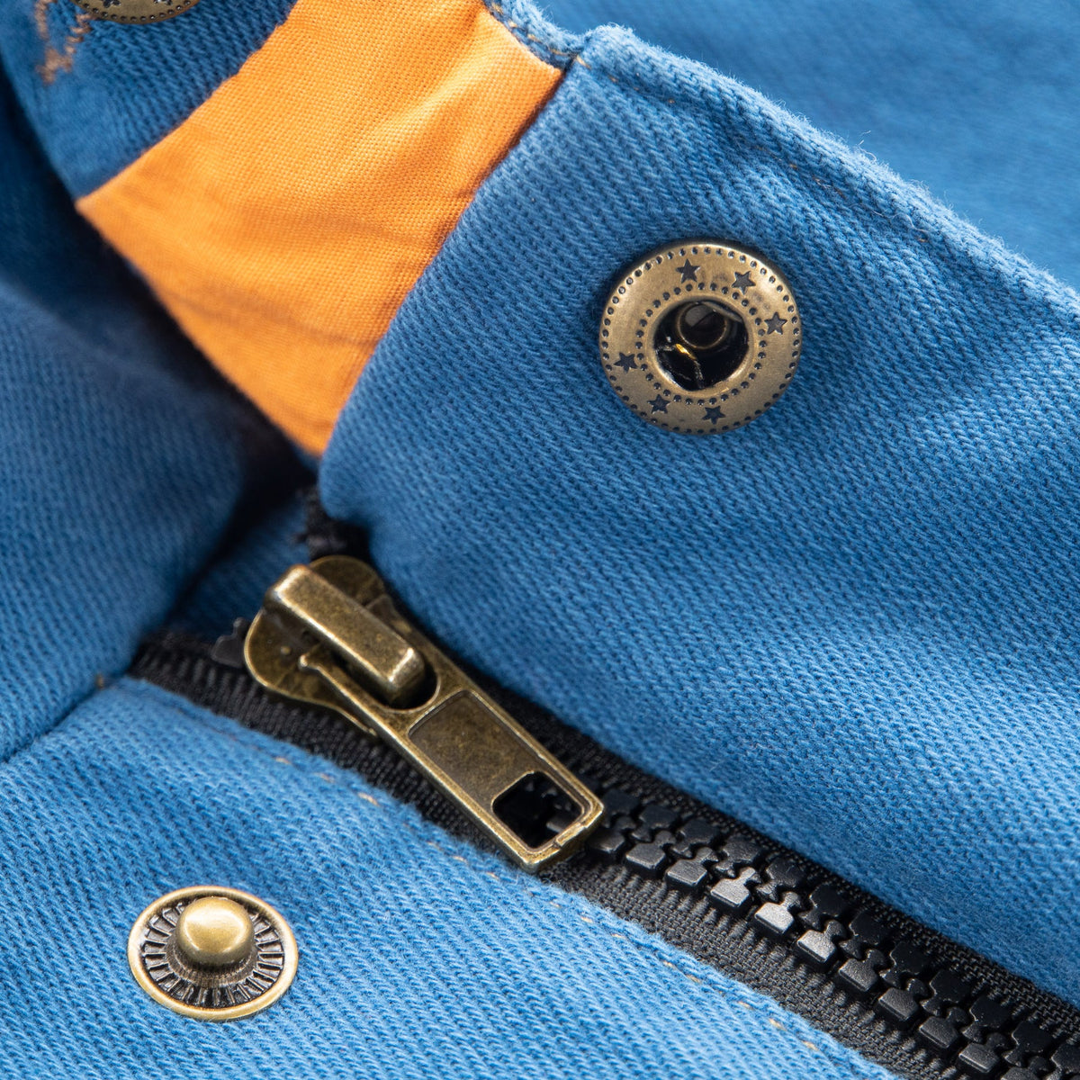 Blue hooded coat, Long sleeves, Adjustable hoodie, double fastened from the front by a zipper and snap buttons. 