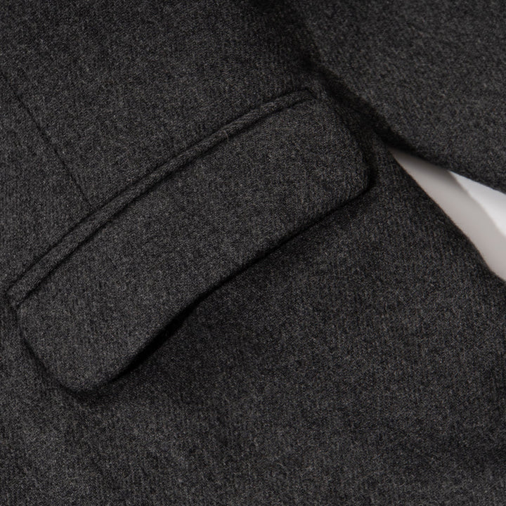 Black jacket. Button Fastened at the front, two large pockets included.