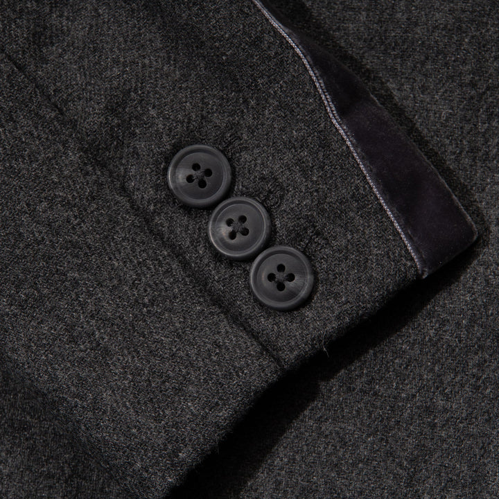 Black jacket. Button Fastened at the front, two large pockets included.