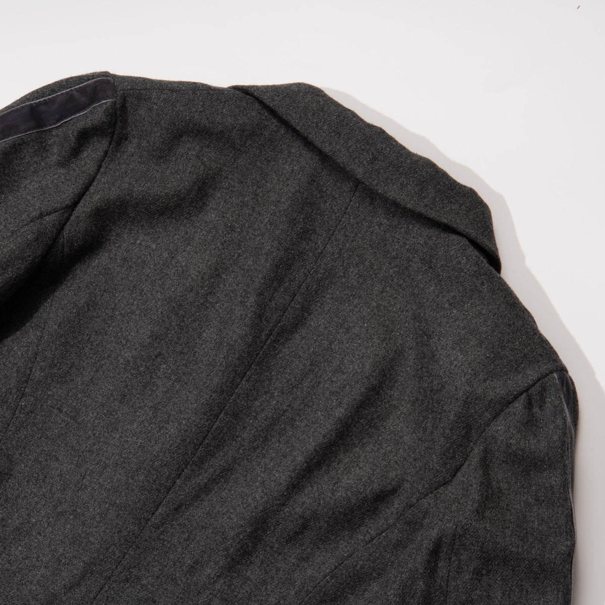Black jacket. Button Fastened at the front, two large pockets included.