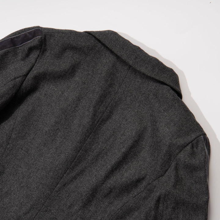 Black jacket. Button Fastened at the front, two large pockets included.