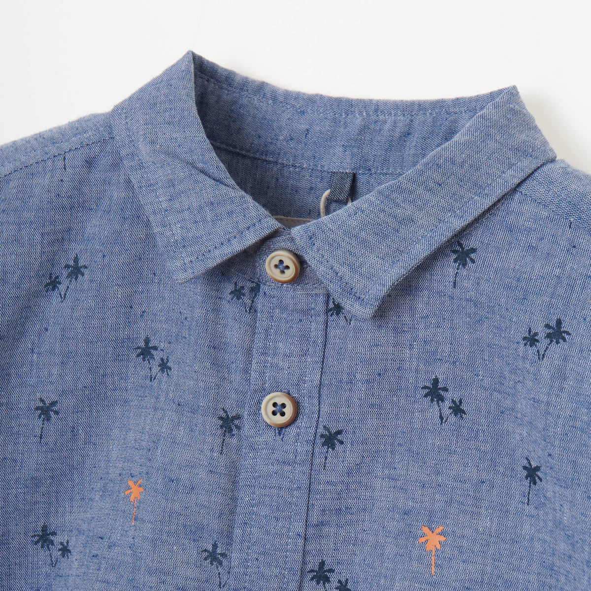 Greyish blue, long sleeve shirt, palm tree prints all over the front panels. Wide spread collar, buttoned front and cuffs. Poney logo embroidered. 