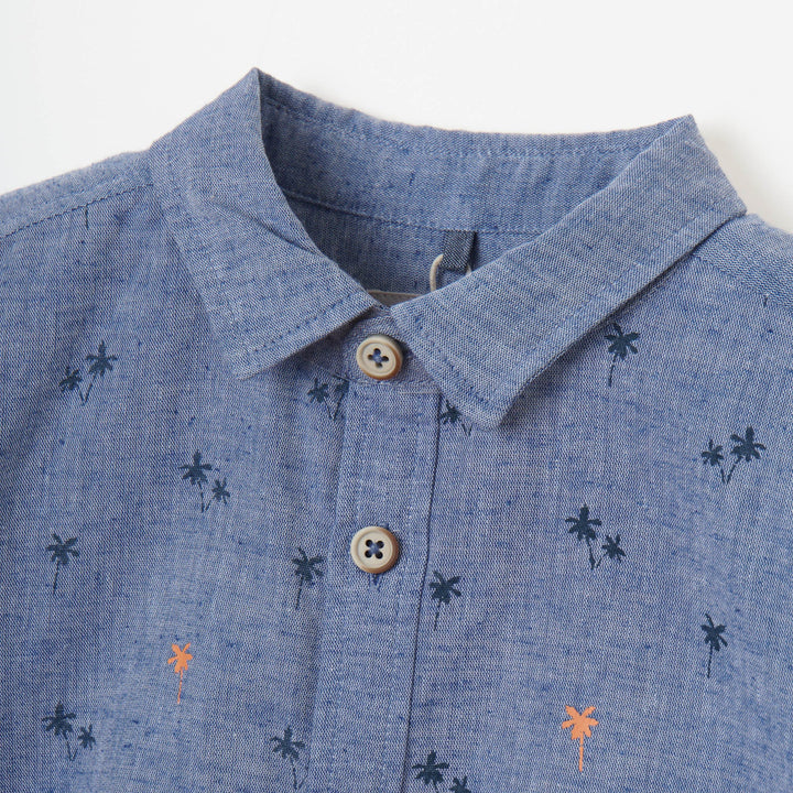 Greyish blue, long sleeve shirt, palm tree prints all over the front panels. Wide spread collar, buttoned front and cuffs. Poney logo embroidered. 