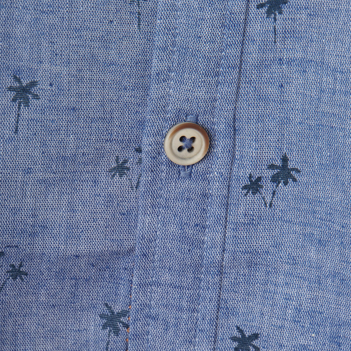 Greyish blue, long sleeve shirt, palm tree prints all over the front panels. Wide spread collar, buttoned front and cuffs. Poney logo embroidered. 