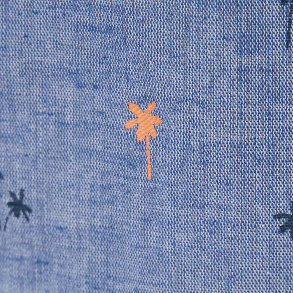 Greyish blue, long sleeve shirt, palm tree prints all over the front panels. Wide spread collar, buttoned front and cuffs. Poney logo embroidered. 
