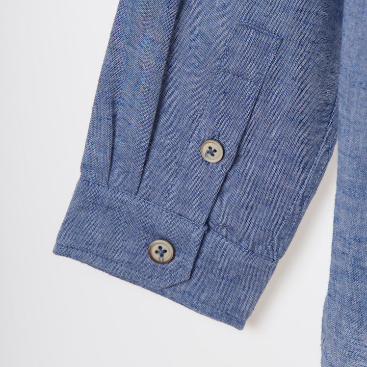 Greyish blue, long sleeve shirt, palm tree prints all over the front panels. Wide spread collar, buttoned front and cuffs. Poney logo embroidered. 