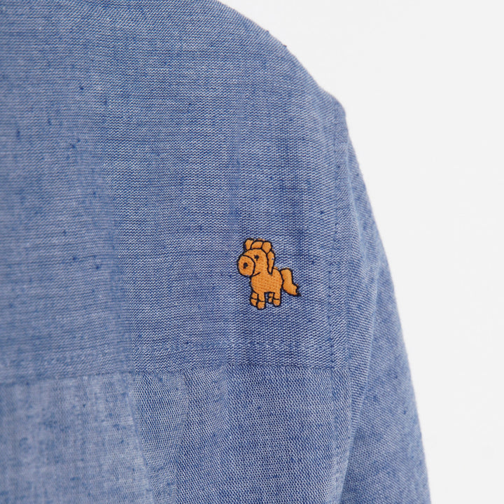 Greyish blue, long sleeve shirt, palm tree prints all over the front panels. Wide spread collar, buttoned front and cuffs. Poney logo embroidered. 