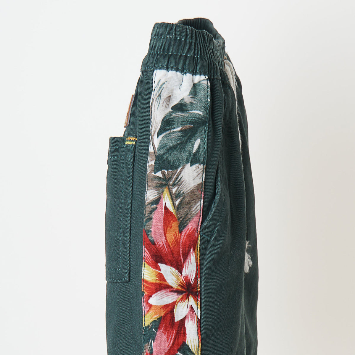 Green Shorts, Floral Side Stripes, Tacked functional fancy drawstrings, Poney Logo, One Pocket at the back.