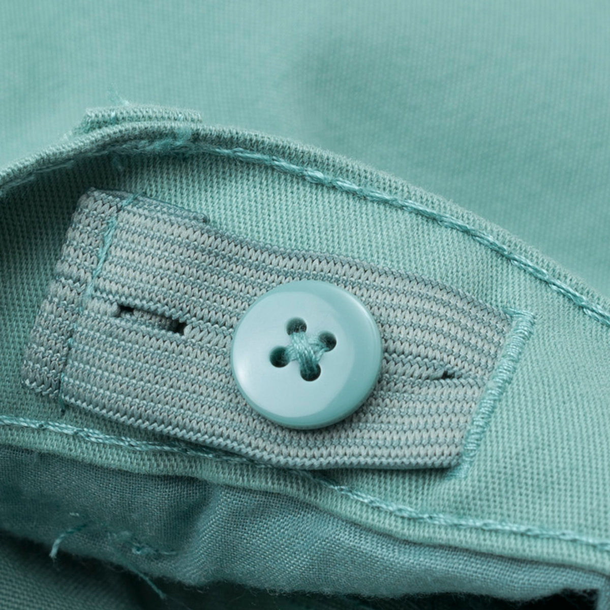 Elasticated sea green trouser, two front and back pockets, a poney logo, a buttoned pocket added at the back. Front button/ zipper fastening also included. 