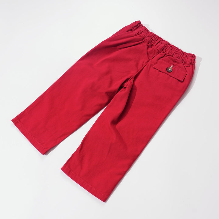 Elasticated red trouser, front button and zipper fastening. Two front pockets and poney logo, buttoned back pocket. 