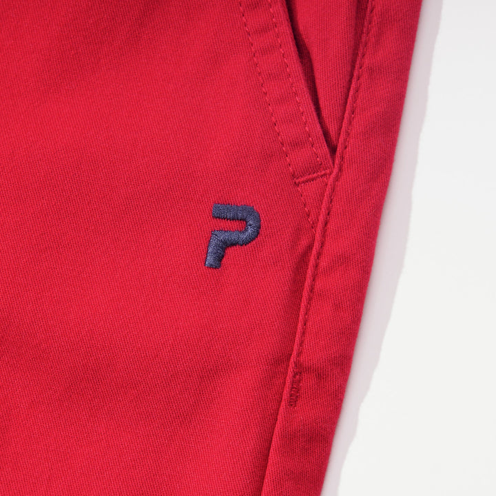 Elasticated red trouser, front button and zipper fastening. Two front pockets and poney logo, buttoned back pocket. 
