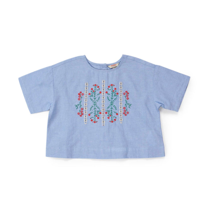 Cropped blue, short sleeves blouse, floral embroidery in the centre. Back fastened by buttons. 