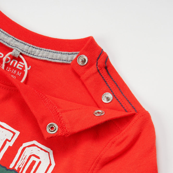 Red Dinosaur printed Top, long sleeves, buttoned shoulder strap.  