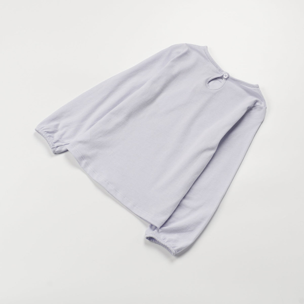 Light Blue ,Long Sleeve t-shirt with a big snoozing heart and poney print, buttoned at the back.