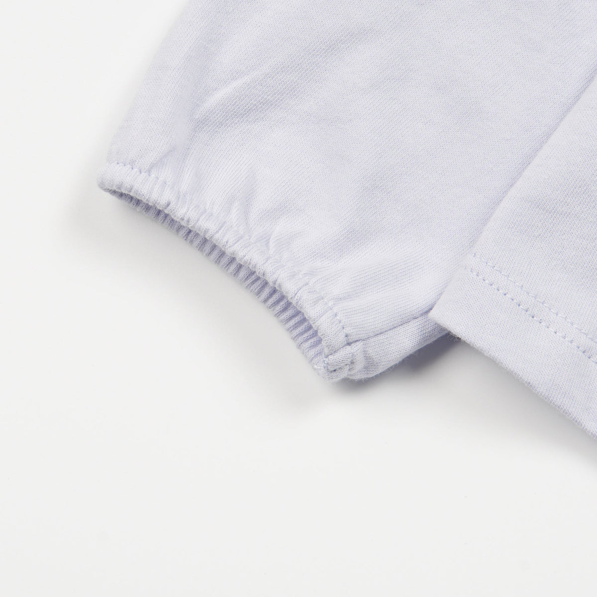 Light Blue ,Long Sleeve t-shirt with a big snoozing heart and poney print, buttoned at the back.