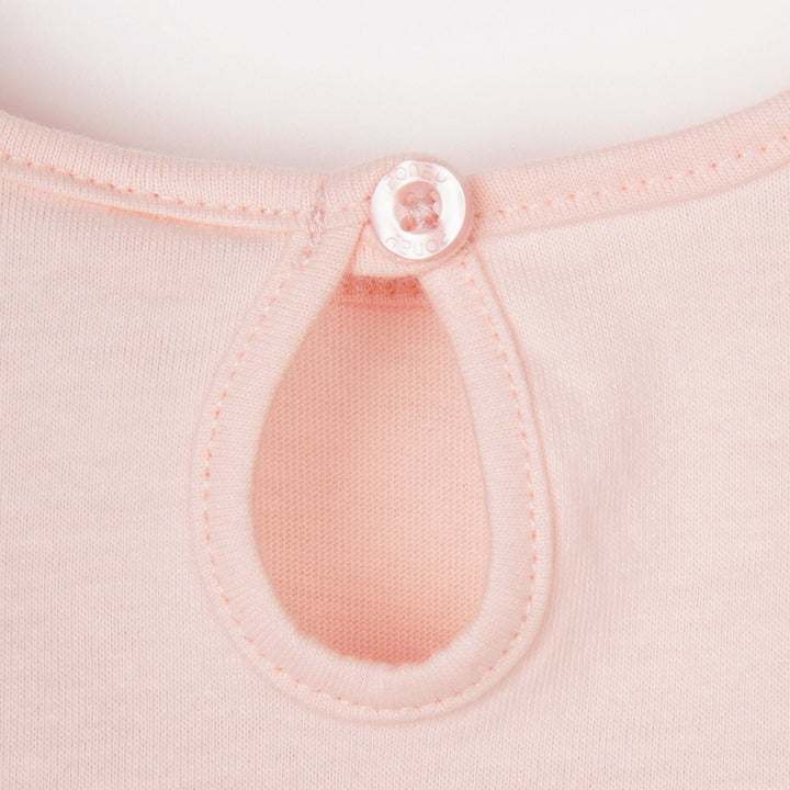 Light pink 'poney' heart t-shirt, short sleeve, a buttoned nape. 