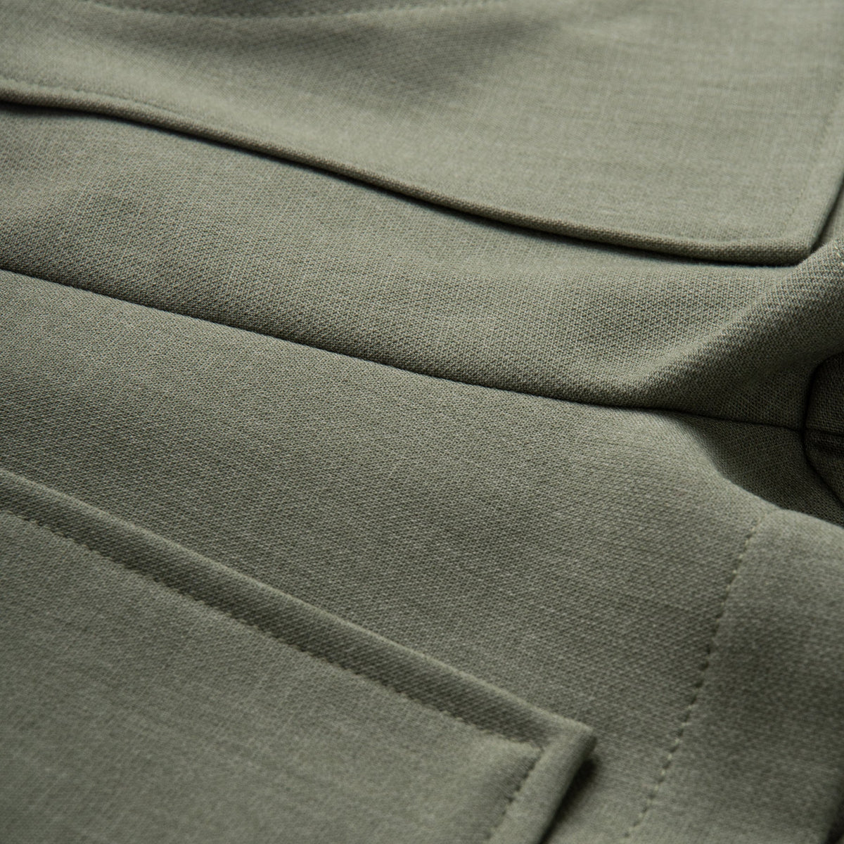 Green Pocket shorts, a pink bow waist fastening at the front. 