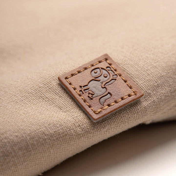Uniquely styled, side fastening khaki, elasticated, side and back pockets included. Logo tag attached at the front.