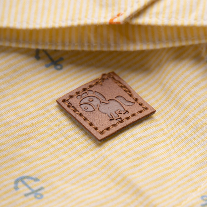 Yellow, full sleeve, collared, sailor shirt, with front buttons. Buttons included to sleeve to be rolled up and on cuffs. Poney tag stitched on the side.