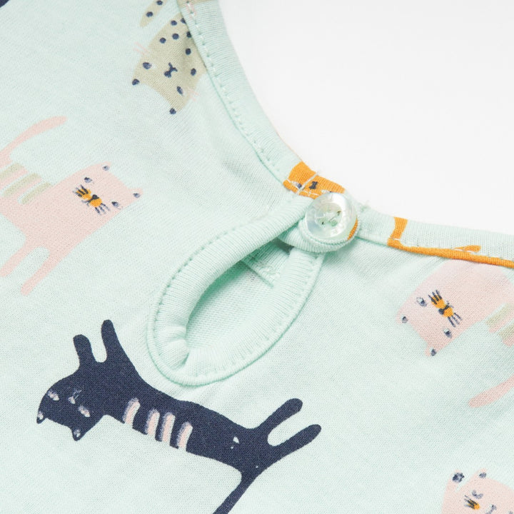Green Falling Cats t-shirt, short sleeve and a buttoned nape. 
