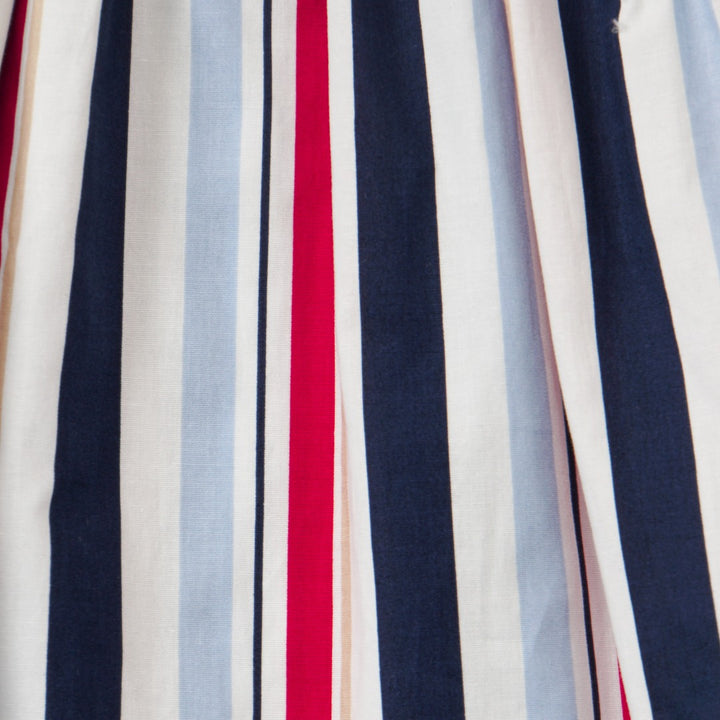 Wide striped multi-color dress, a red double bow belt, and zipper at the back.