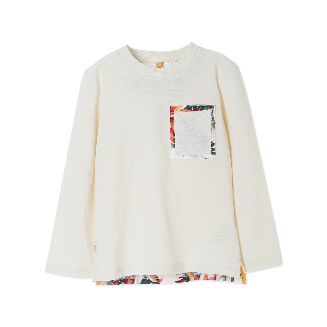 Cream colored, long sleeve top, hidden floral strap visible at the nape, front pocket and backside hem. 