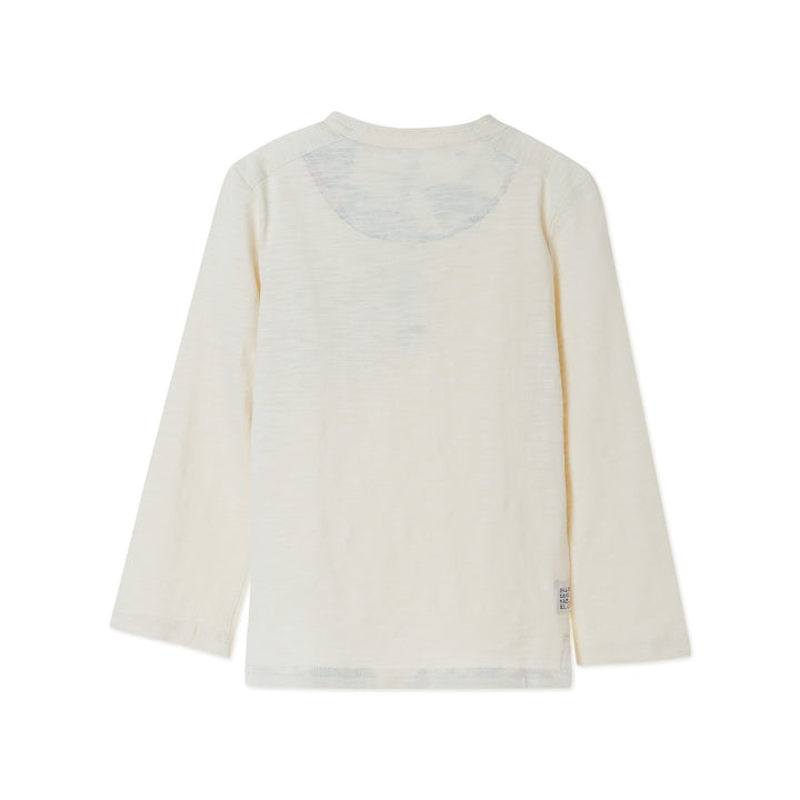 Cream colored, long sleeve top, hidden floral strap visible at the nape, front pocket and backside hem. 