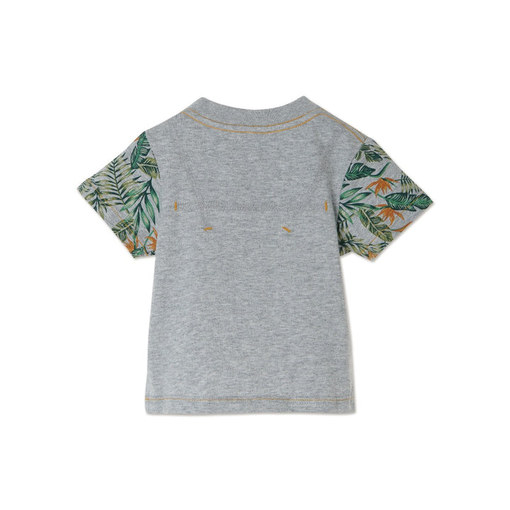 Melange top, short sleeve, beautiful tropical leaves design on sleeves and pocket. Buttoned shoulder strap, a logo strap on the bottom. 