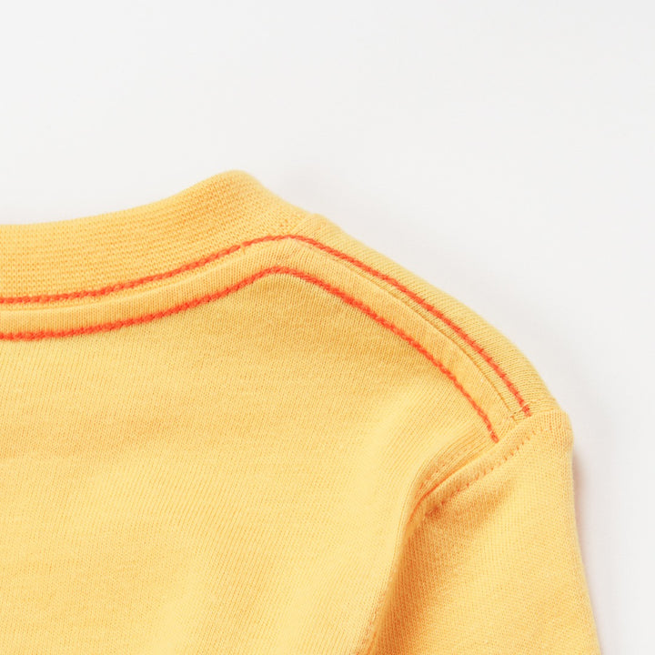 'Super Cool Monster' printed, yellow top, long sleeves, shoulder buttons. 