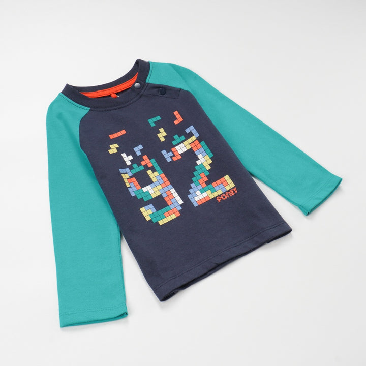 green and navy top, tetris design with shoulder fastening. 