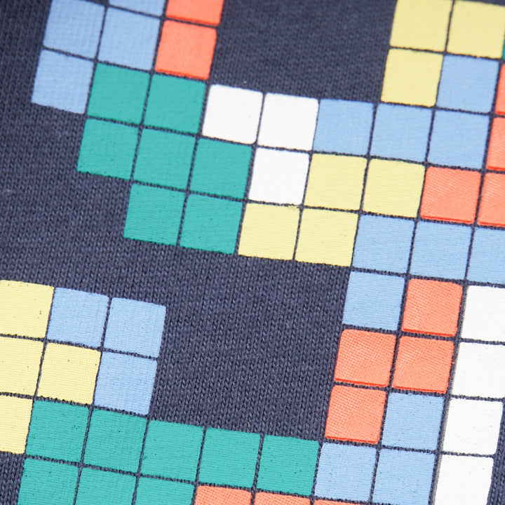 green and navy top, tetris design with shoulder fastening. 