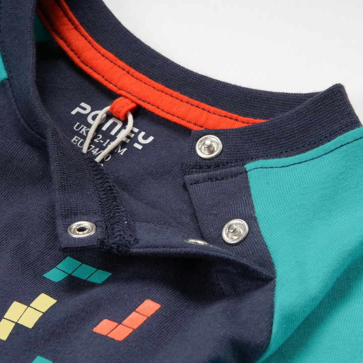 green and navy top, tetris design with shoulder fastening. 