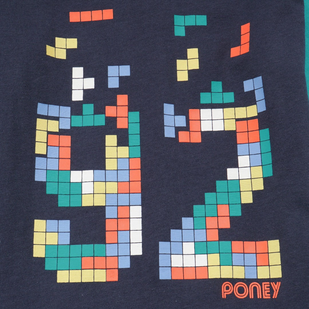 green and navy top, tetris design with shoulder fastening. 