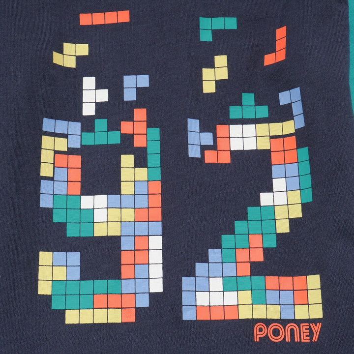 green and navy top, tetris design with shoulder fastening. 