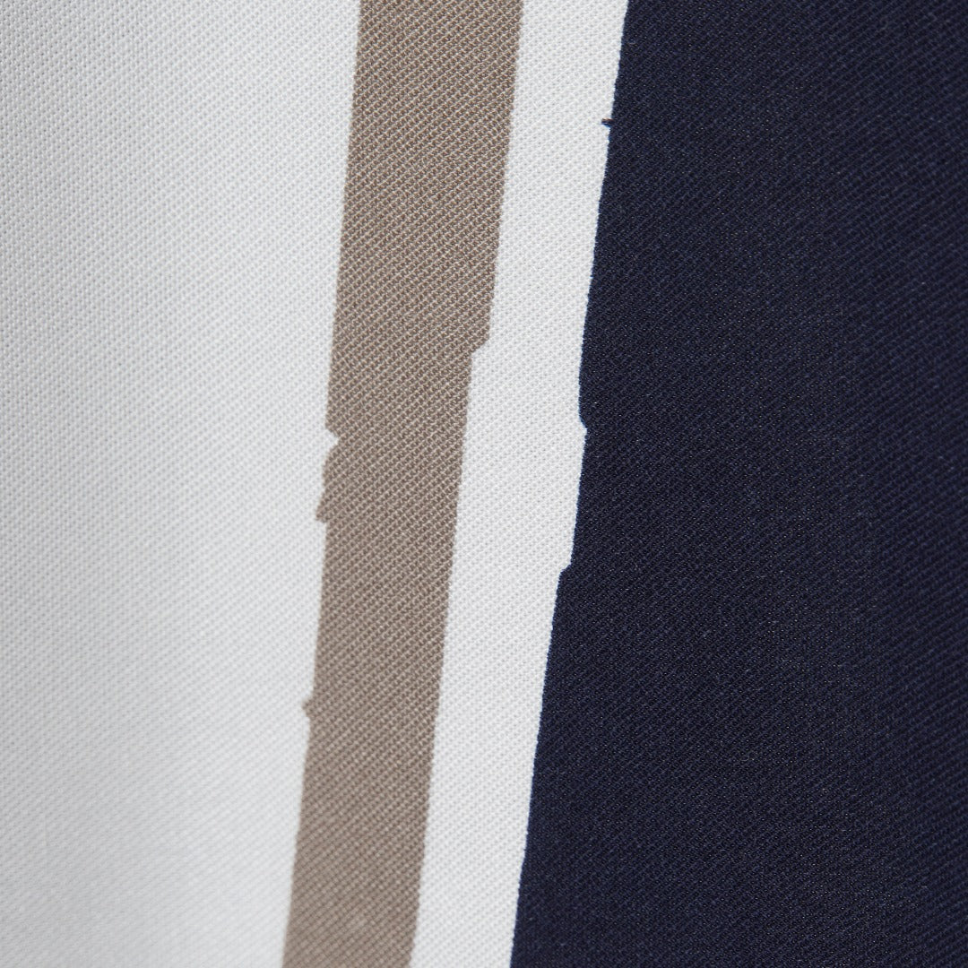 A solid striped dress with a long bodice and a frilly skirt attached. Buttoned at the back, sleeveless dress in muted pink, blue and black solid lines. 