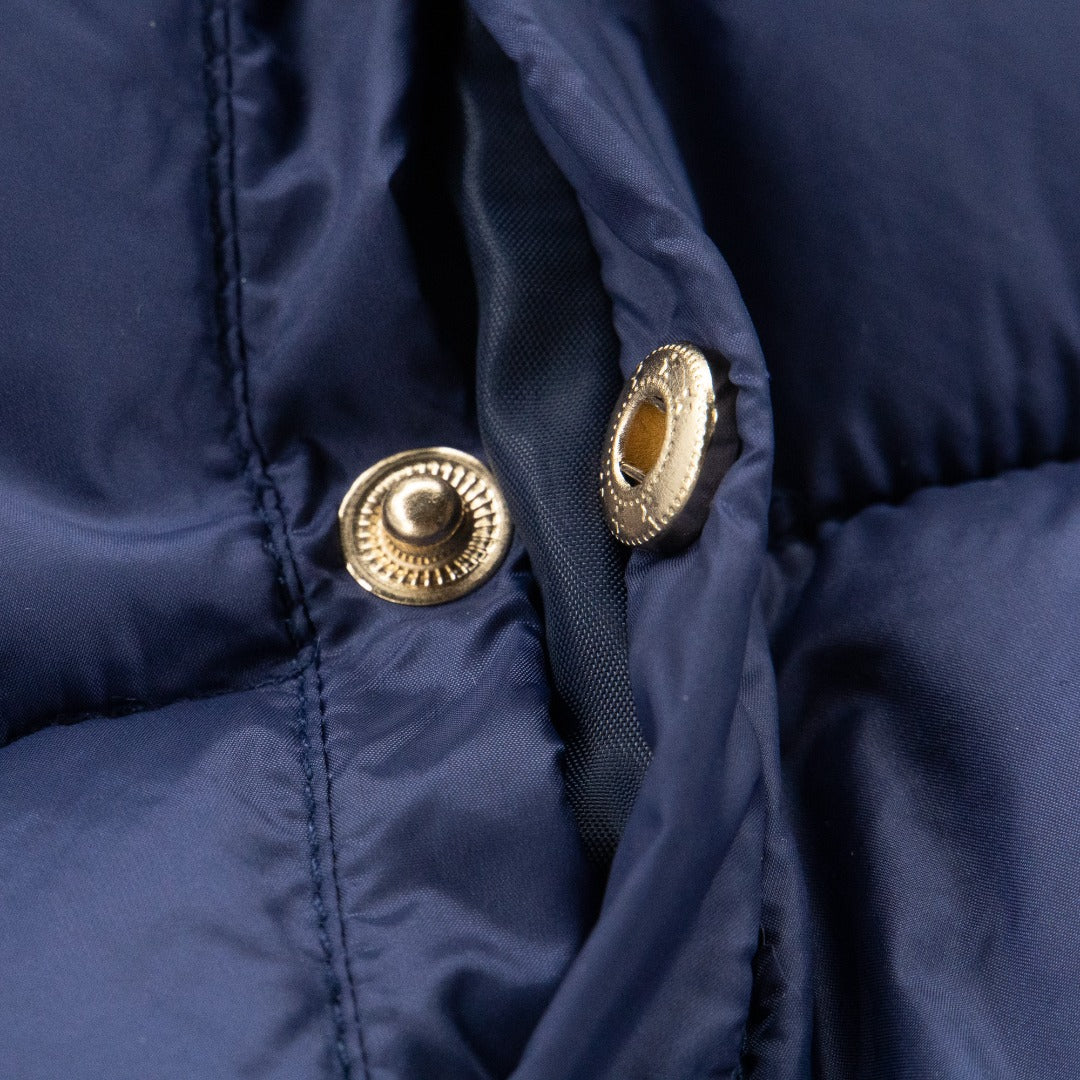 Navy Blue Padded Jacket with a hoodie and knitted long sleeves, golden zipper and snap-button fastening on pockets at the front.