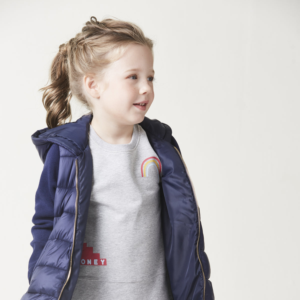 Navy Blue Padded Jacket with a hoodie and knitted long sleeves, golden zipper and snap-button fastening on pockets at the front.